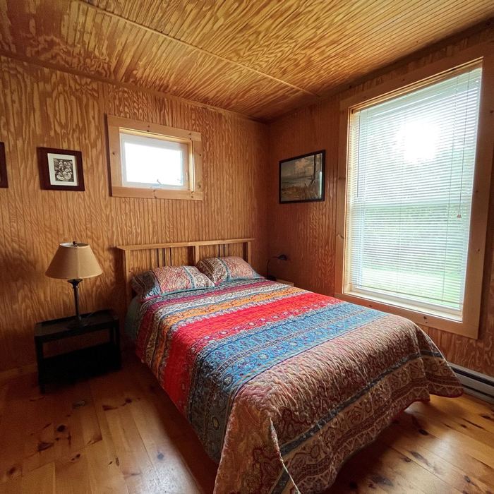 Bedroom with a full size bed and window
