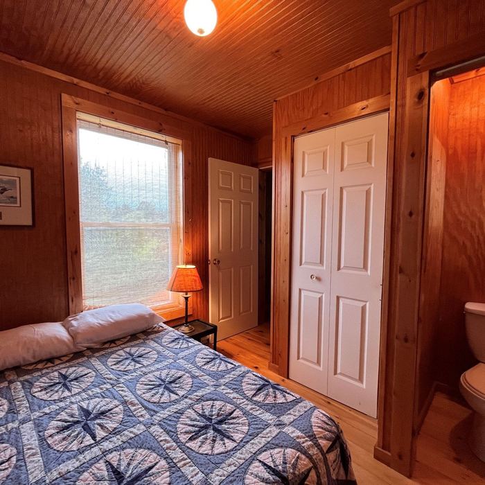 Second bedroom with a bed and closet