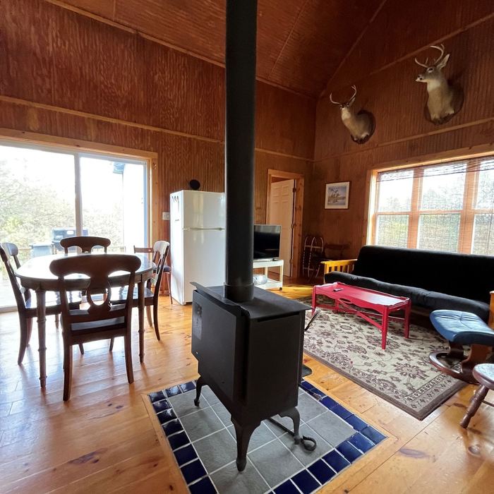 Wood stove and dining table in the main room