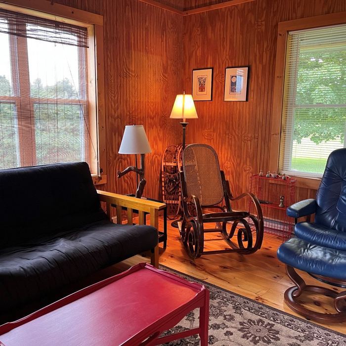 Living area with futon, rocking chair and coffee table